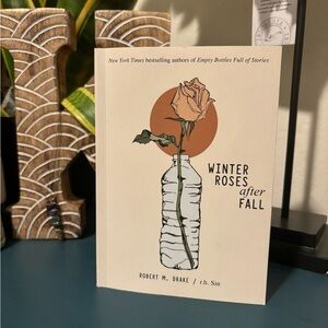 Winter roses after fall by Robert M. Drake